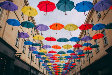 umbrellas cover an alleyway